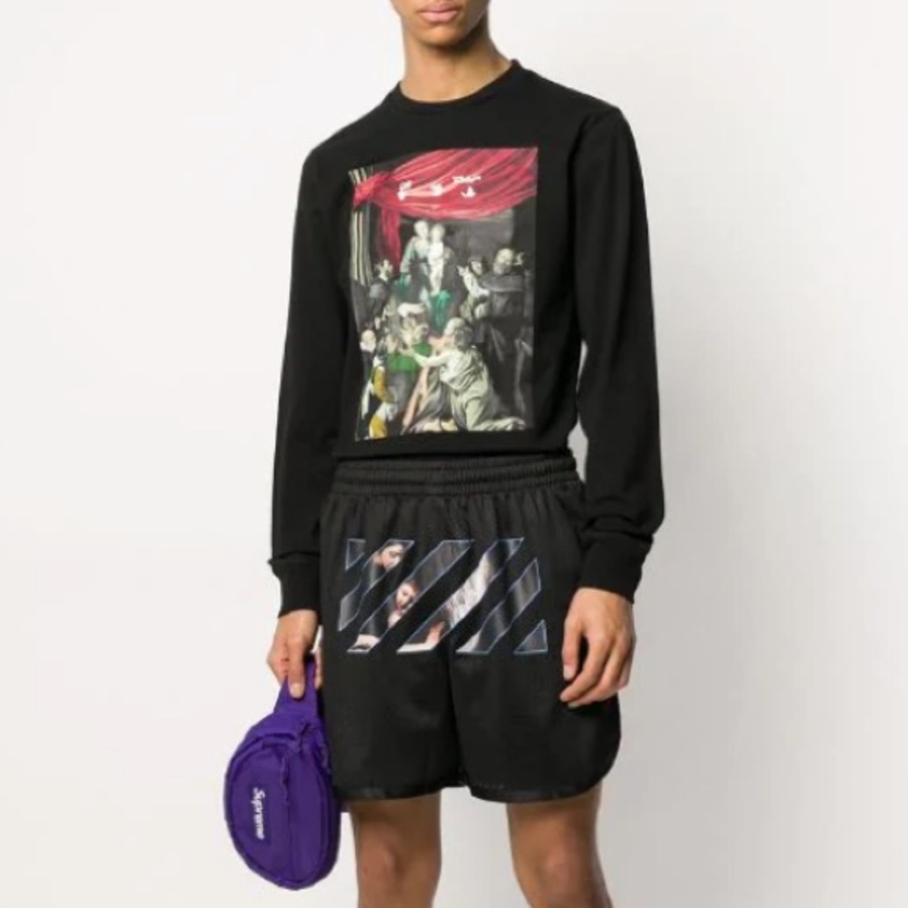 Off-white track shorts.